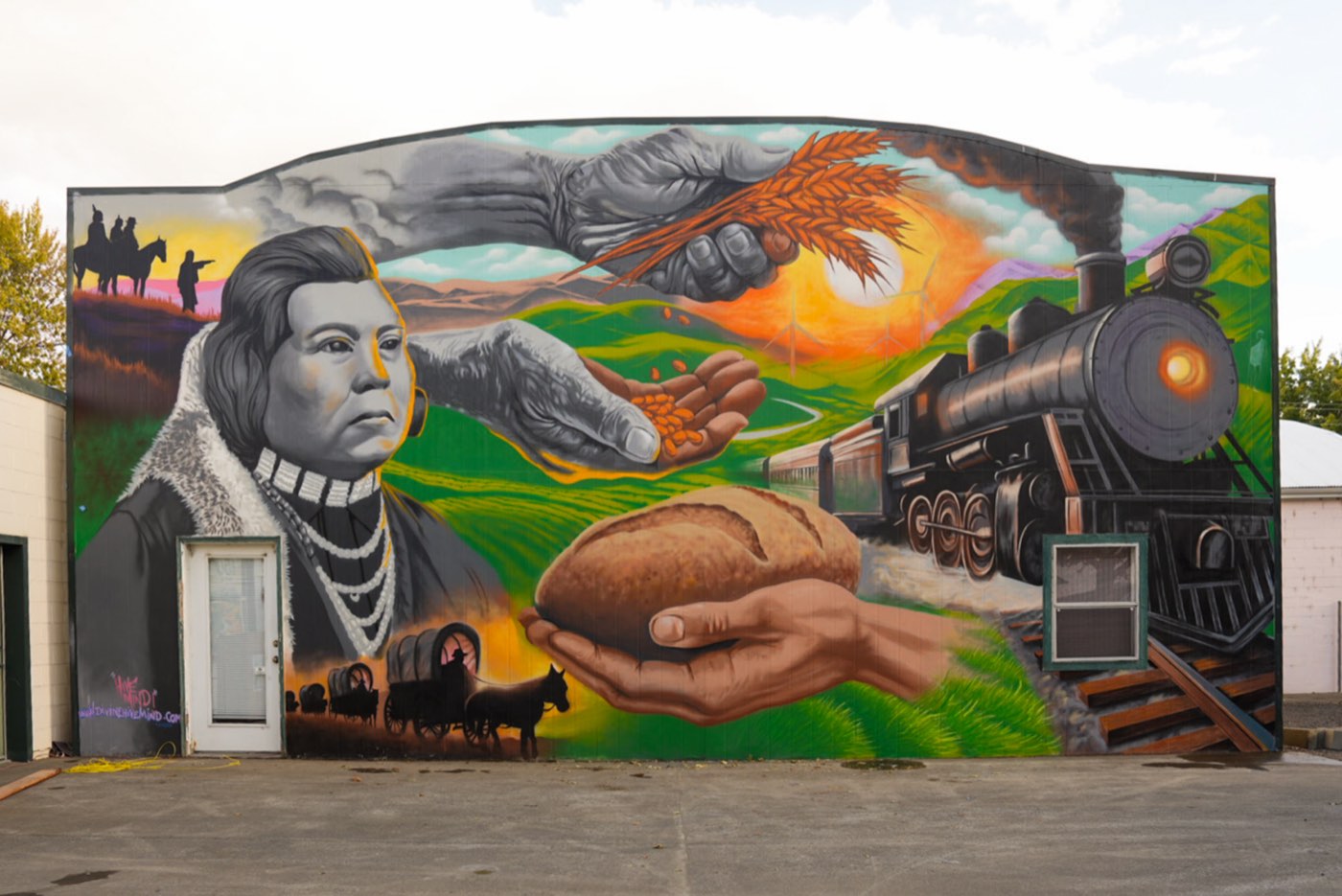 Columbia County Sesquicentennial mural covering a full building face in Dayton, Washington