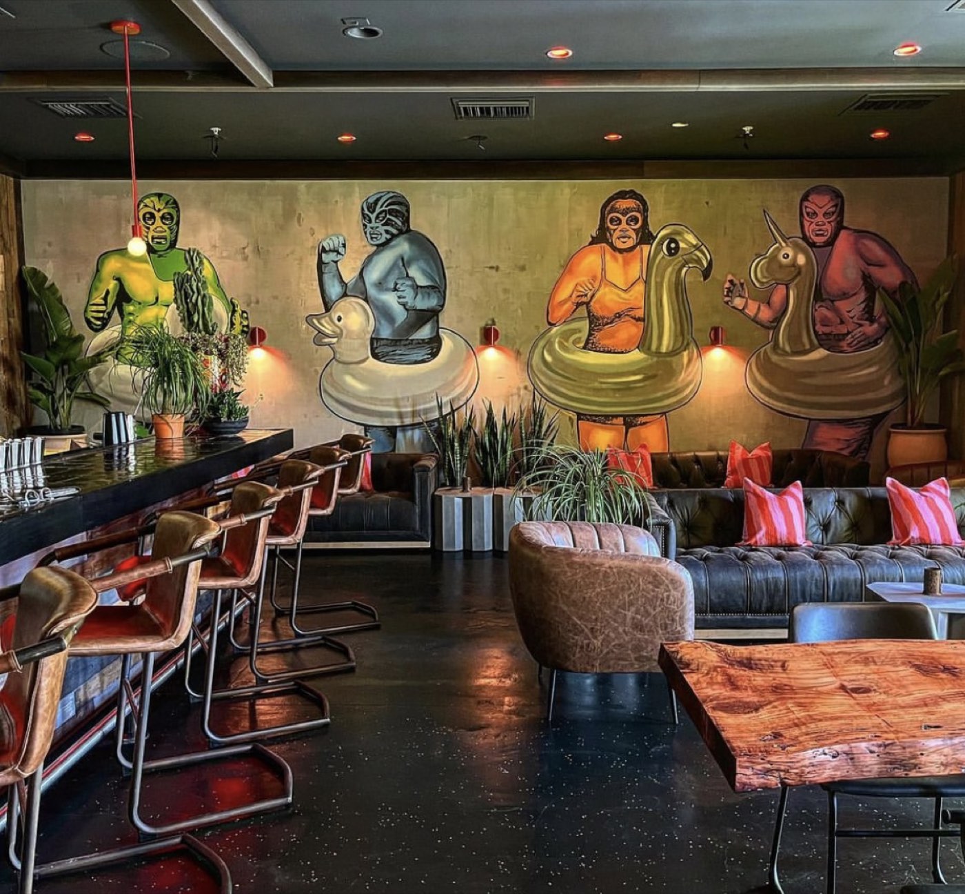 Lucha libre wrestlers in pool floats painted across the lounge wall of El Jefe Cantina at the Saguaro Hotel, Palm Springs